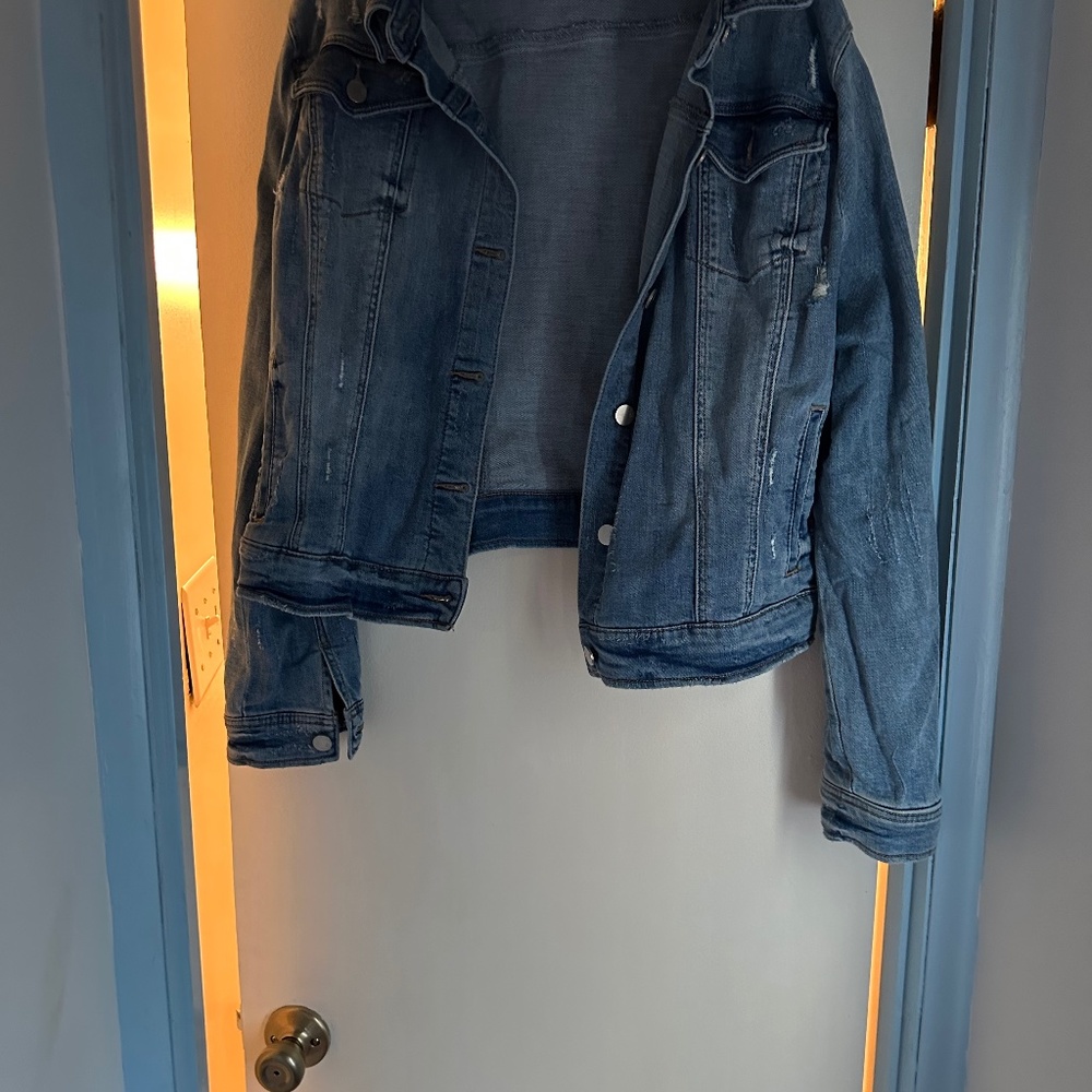 Distressed denim jacket